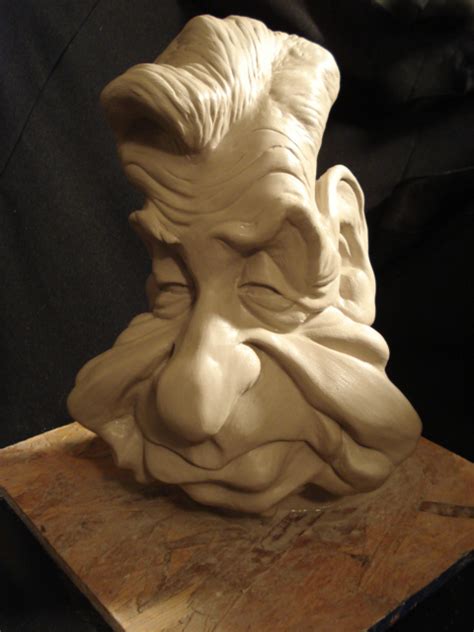 collection of 94 silly faces|crazy looking caricature type sculptures.